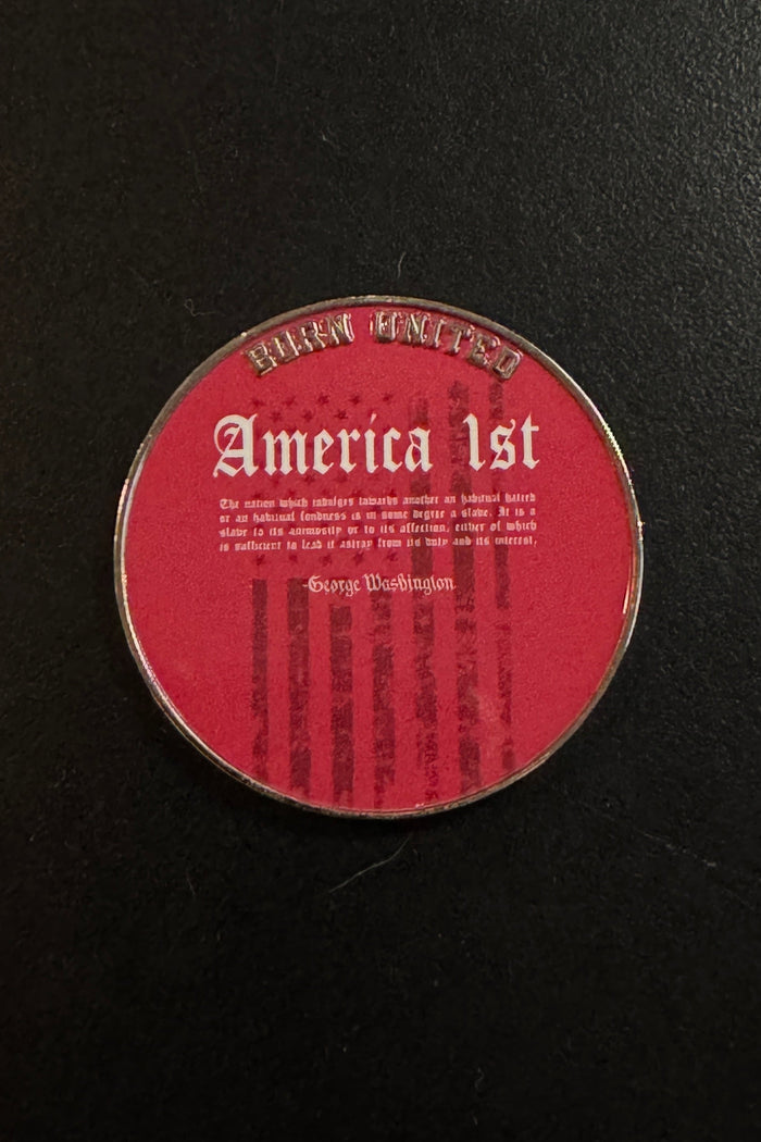 A round America First Challenge Coin by Born United Private Label features a red background with โAmerica 1stโ inscribed on it and a quote attributed to George Washington, set against faint American flag stripes.