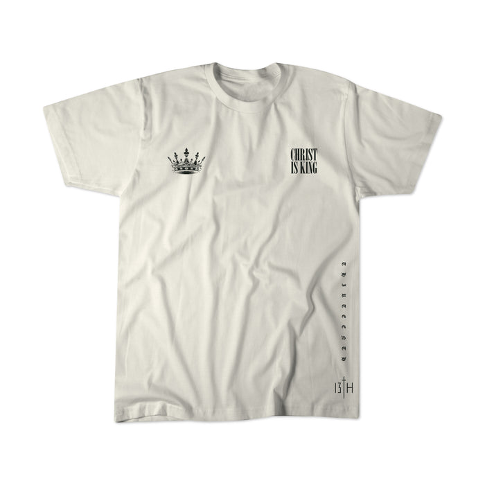 The Christ is King Premium Tee - Ivory by 13th features a bold black crown graphic, vertical “CHRIST IS KING” text, and standout “13TH” detail—a perfect statement shirt for believers.