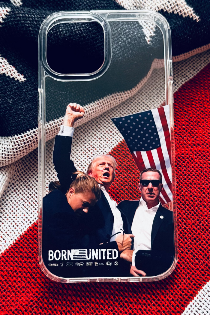 The Forever Legend iPhone Case by Born United Private Label features three men—one raising a fist, another holding an American flag—with “BORN UNITED” below, all set against an American flag fabric background. Transparent design.