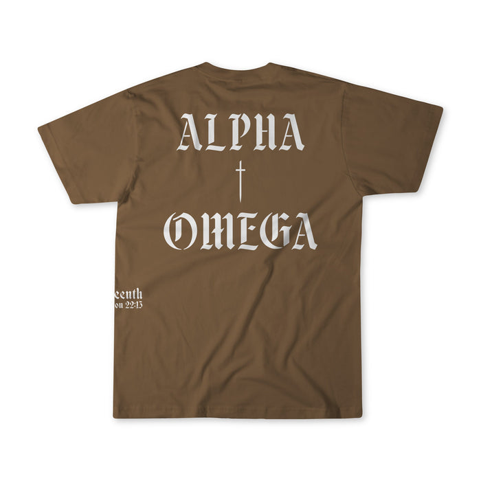 The 13th Alpha & Omega Premium Oversized Tee in Espresso features large white gothic "Alpha & Omega" print with a small cross on the back, plus a small white text detail near the lower left hem.