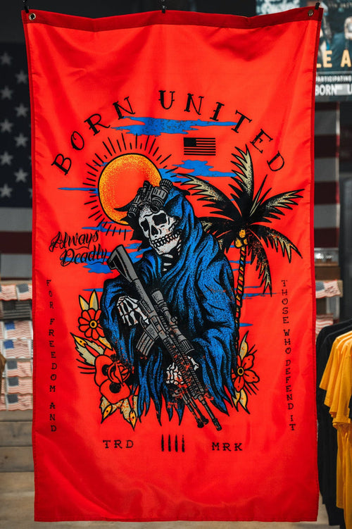 The Always Deadly Flag by Born United Private Label features a grim reaper in a blue hood with a rifle on a red banner, plus sun, palm tree, and American flag accents. "Born United" and "Always Deadly" highlight its patriotic military design.