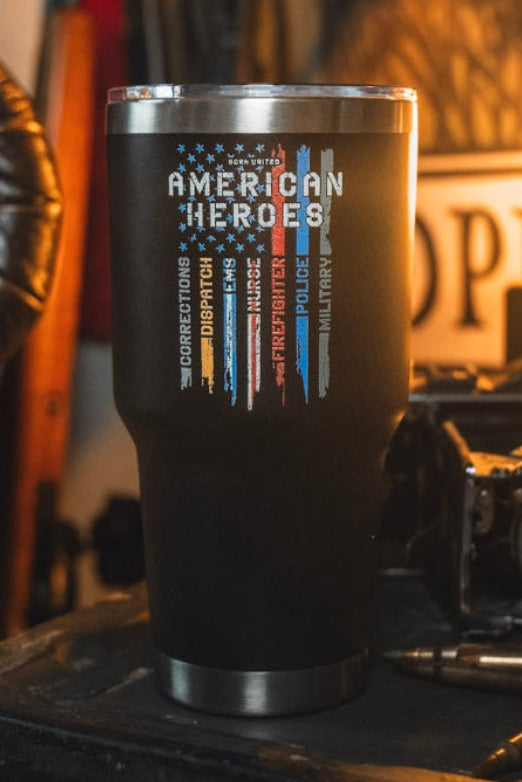 The Born United Private Label "American Heroes Tumbler - 30oz" features a black finish, an American flag, and “American Heroes” with corrections, dispatch, EMS, fire rescue, police & military listed on the front.