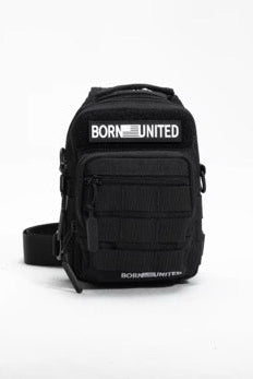 The Born United Private Label Black Phantom Tactical Sling-Pac - 4L is a compact black crossbody bag with "BORN UNITED" in white on both front pockets, displayed on a plain white background—ideal for carrying and organizing essentials.