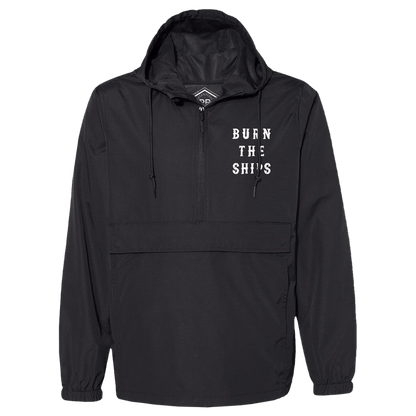 The Relentless Betrayals Burn the Ships Pullover Rain Jacket is a unisex black hoodie with a front zipper, large pocket, and water-resistant coating. It features BURN THE SHIPS in white on the left chest.