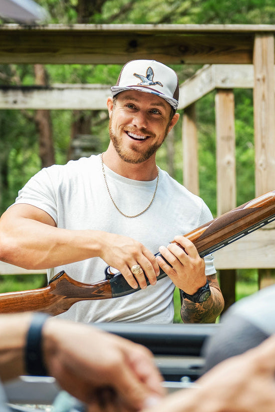 mucker bucket - camo duck bucket hat on men's model