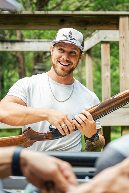 mucker bucket - camo duck bucket hat on men's model