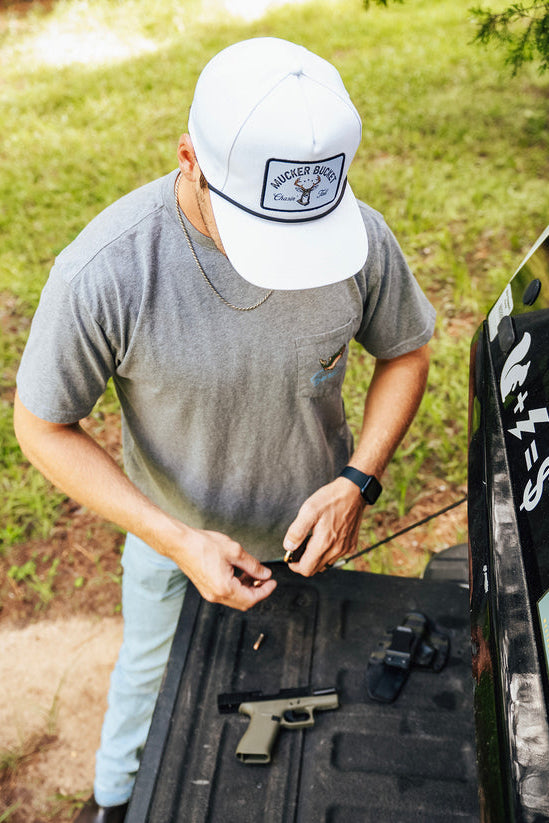 mucker bucket - chasin' tail bucket snapback hat on model