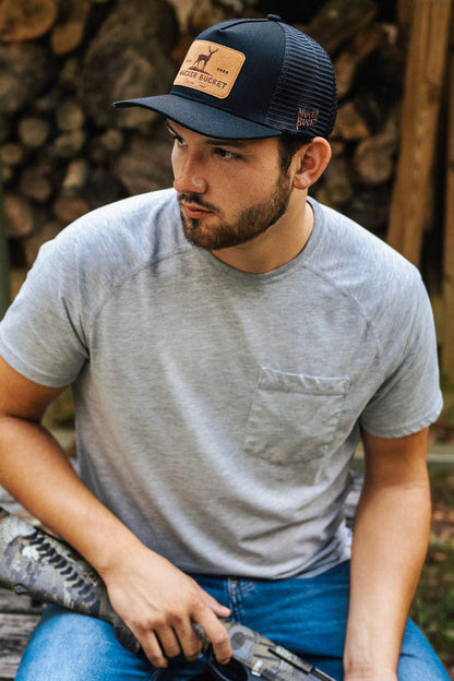 mucker bucket - chasin' tail trucker snapback on model