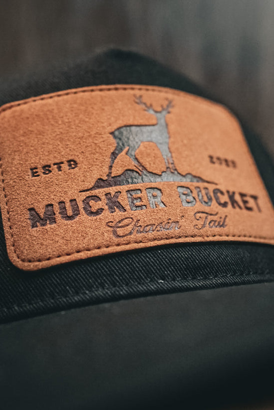 mucker bucket - chasin' tail black logo patch hat