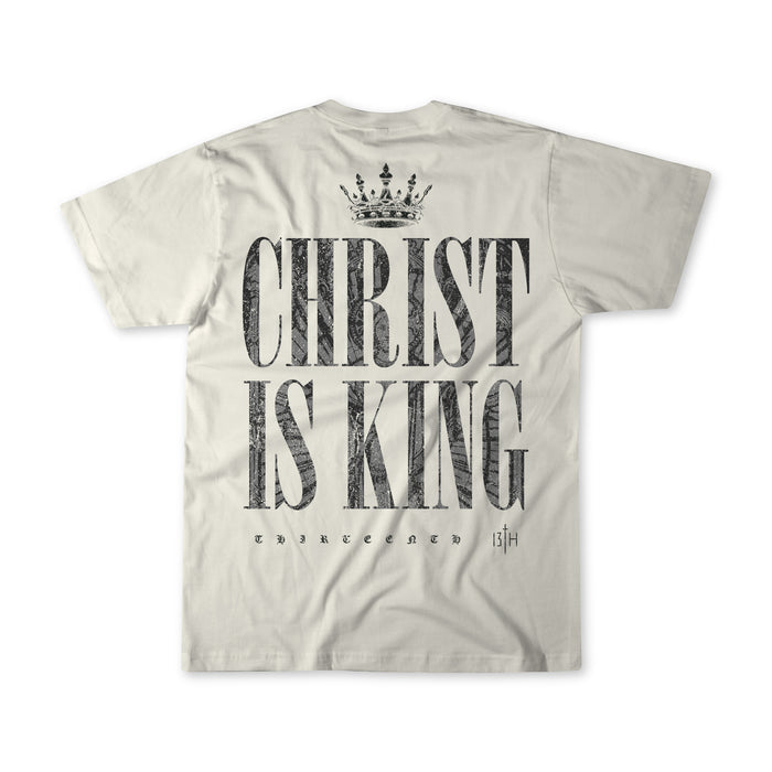 The Christ is King Premium Tee - Ivory by 13th features bold black “CHRIST IS KING” text with a crown graphic on the back and “THIRTEENTH 13|H” below—a standout Christian tee for your faith-inspired collection.
