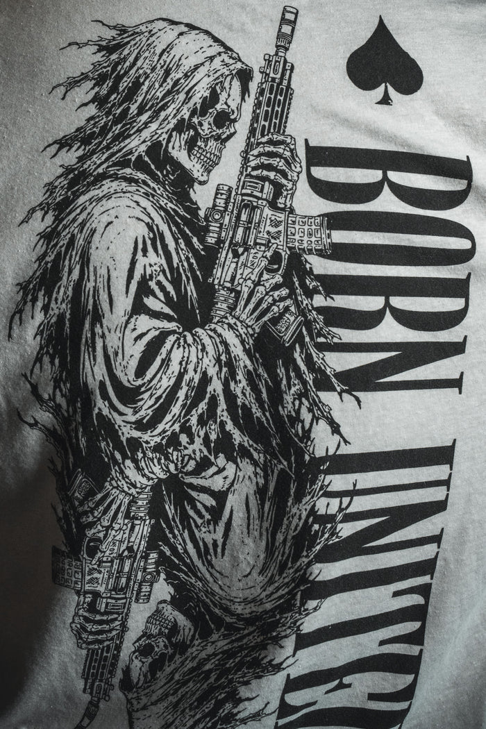 A black-and-white illustration of a grim reaper wielding a rifle, evoking dark aesthetics and wartime symbolism, is featured alongside the words “BORN UNITED” and a spade emblem—distinctly referencing the iconic Death Card tee by Born United Private Label.
