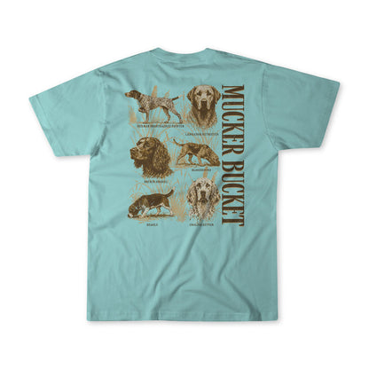 Show off your love for canines with the Dog DNA Premium Tee from Mucker Bucket. This light blue shirt features detailed illustrations of six hunting dog breeds and bold, vertical "MUCKER BUCKET" text on the back. Made from soft, ring-spun cotton, this premium tee offers exceptional comfort—perfect for any dog enthusiast.