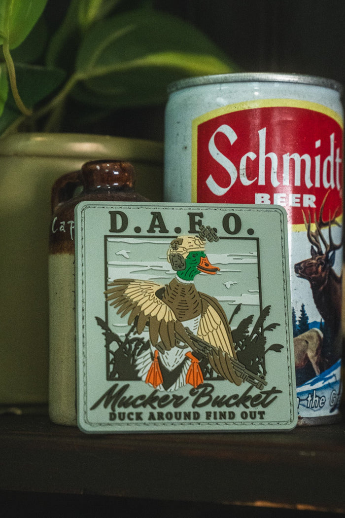 A vintage-style metal tin sign reading 'D.A.