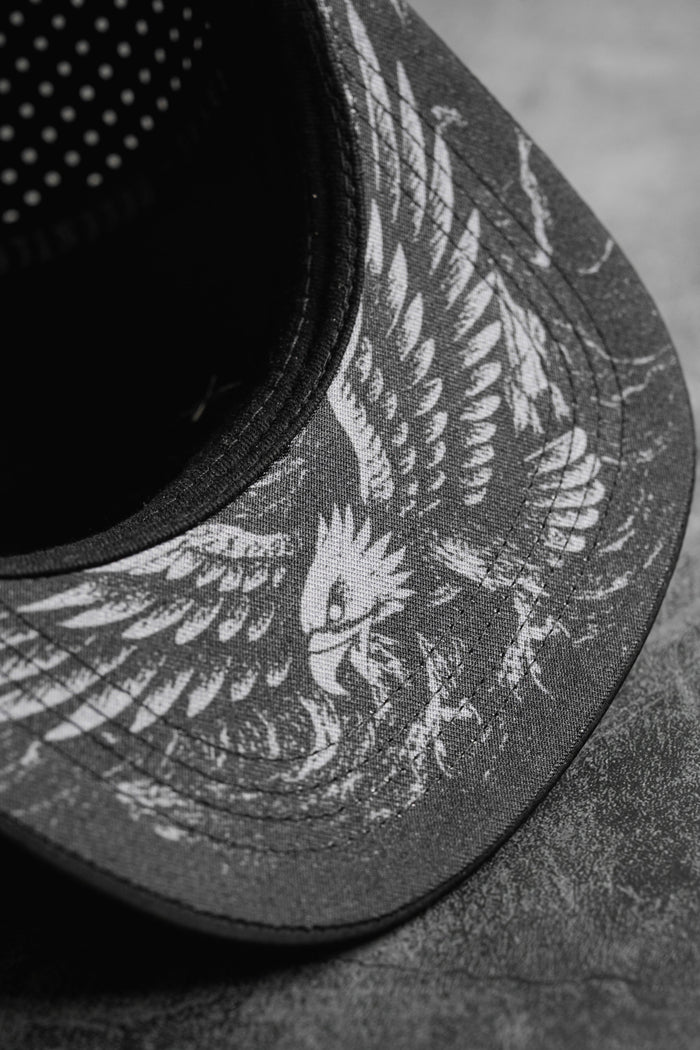 The Relentless Betrayal Hold Steady Ghost Snapback is a premium black and white hat featuring a unique design.