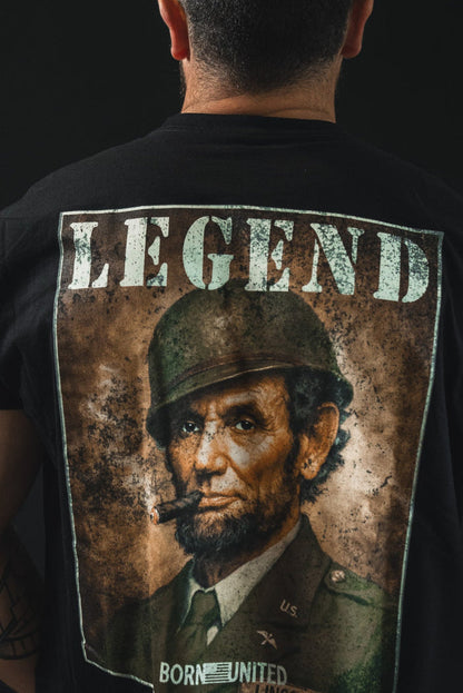 Wearing the Legend - Lincoln tee by Born United Private Label, featuring Abraham Lincoln as a soldier smoking a cigar with "LEGEND" above, adds bold American heritage style to any look.