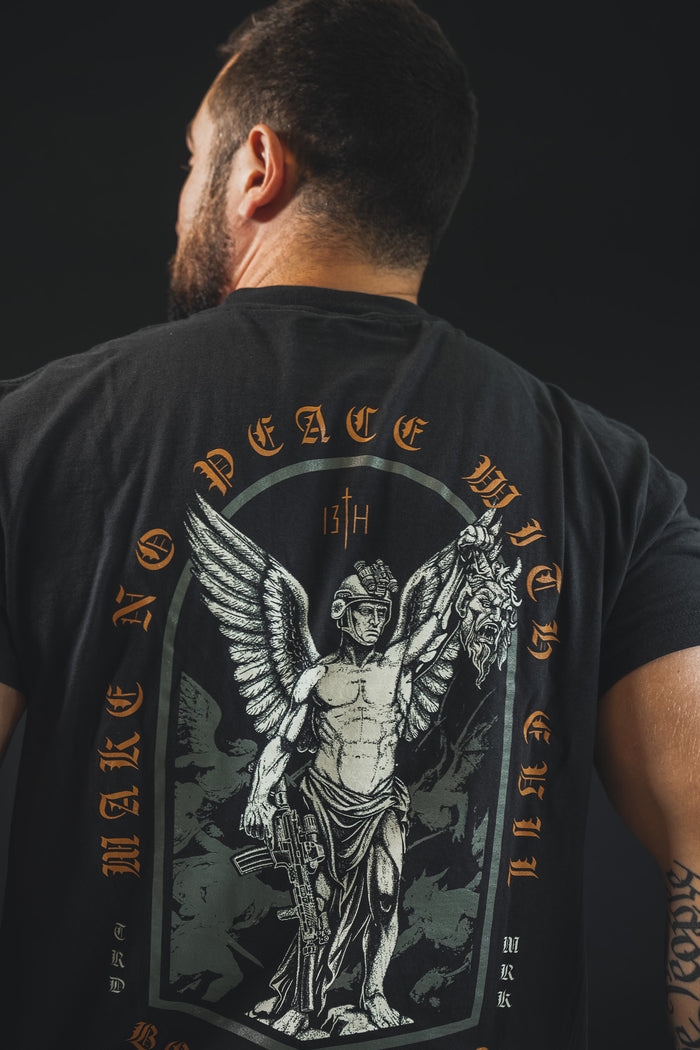 A man is seen from behind wearing the Born United Private Label “Make No Peace Premium Tee,” featuring a winged warrior with rifle and helmet, and bold text: MAKE NO PEACE WITH EVIL.