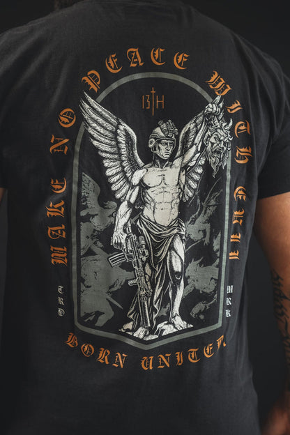 A person wears the Born United Private Label's Make No Peace Premium Tee, a black cotton shirt with a winged armored figure, rifle, and severed head. It features “MAKE NO PEACE WITH EVIL, BORN UNITED. 13TH.” in bold text.