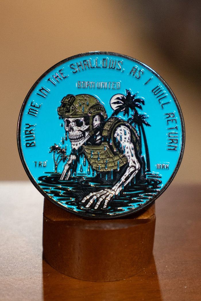 The Shallows Challenge Coin by Born United Private Label shows a skeleton in military gear rising from water with palm trees, encircled by the words, "Bury me in the shallows, as I will return.