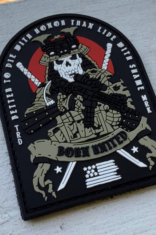 The With Honor PVC Patch by Born United Private Label shows a skeleton in tactical gear with a rifle, crossed katanas, red circle, American flag, and the phrase "Better to die with honor than live with shame. Born United." Velcro backing included.